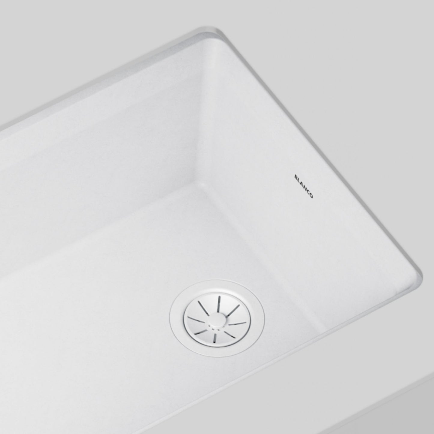 White - BLANCO Essential Silgranit Color-Matched 3.5" Basket Strainer with Turn-to-Close Design