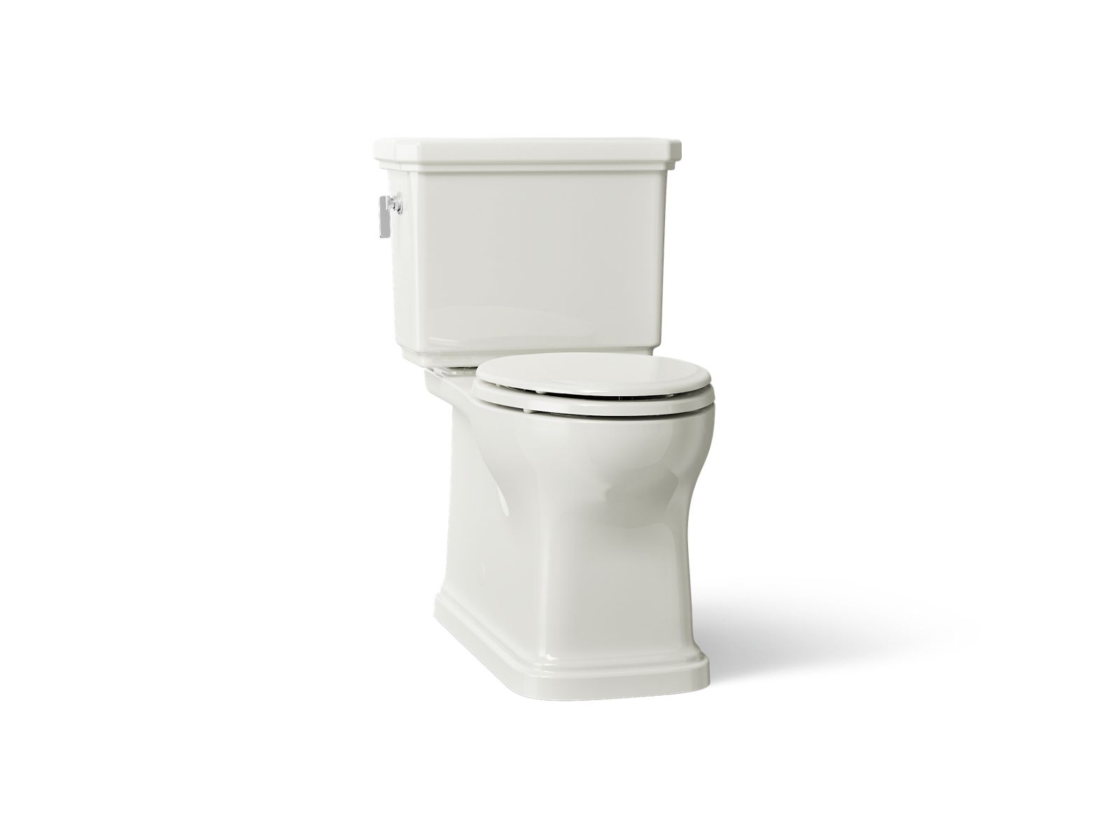 KOHLER K-35960 Claude Two-piece Elongated Toilet with Skirted Trapway, 1.28 GPF, Dune - 3/4 view of product