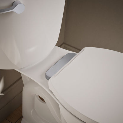 KOHLER K-36593-CP Covert ReadyLatch® Quiet-Close™ Elongated Toilet Seat, White - Shows close up detail of product in room